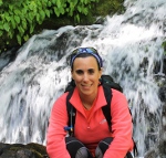 Marina Arcagni next to a waterfall
