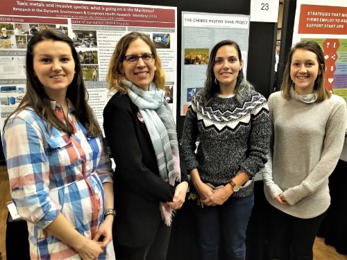 Sarah, Linda, Brittany & Molly in front of the DEEHR Research Expo poster at Saint Mary's University