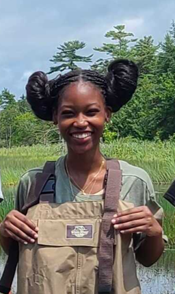 Seychelle wearing waders in the field